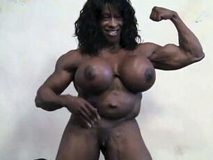 Real dark-hued femmes bodybuilder with yam-sized cupcakes