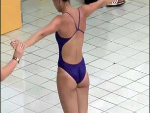 Sexual young lady gymnasts in bikini thong.