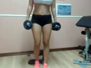 Pretty defined dame kneading puffies on cam in the gym